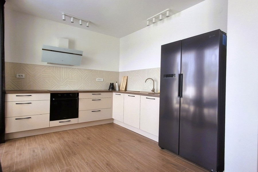 Modern fitted kitchen with high-quality electrical appliances