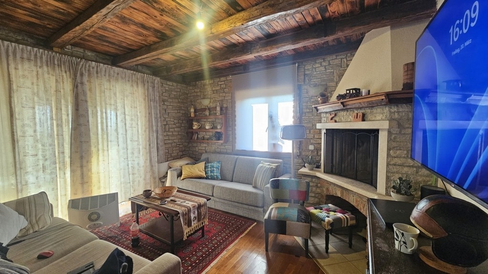 Living room with fireplace in a rustic country house style