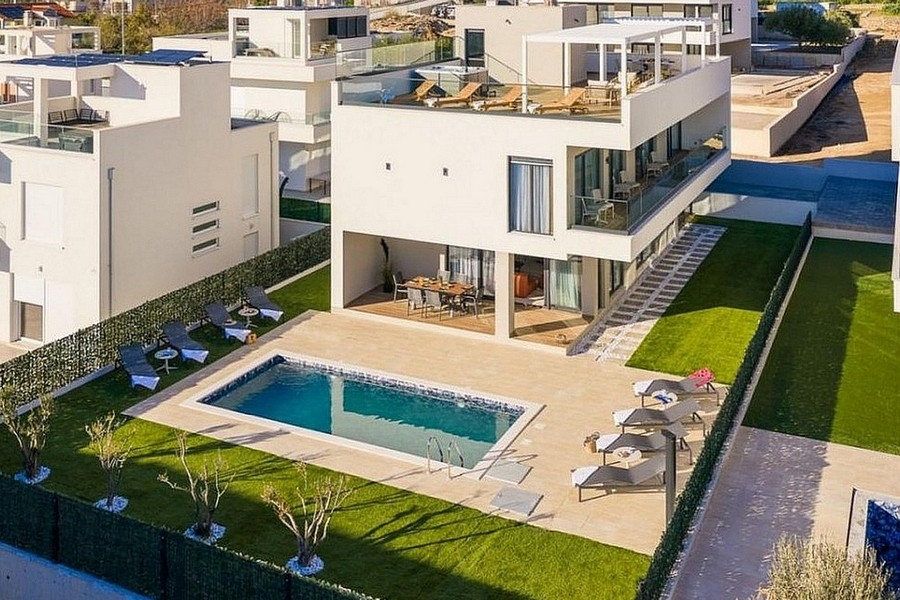 Luxury villa with swimming pool and garden from a bird's eye view