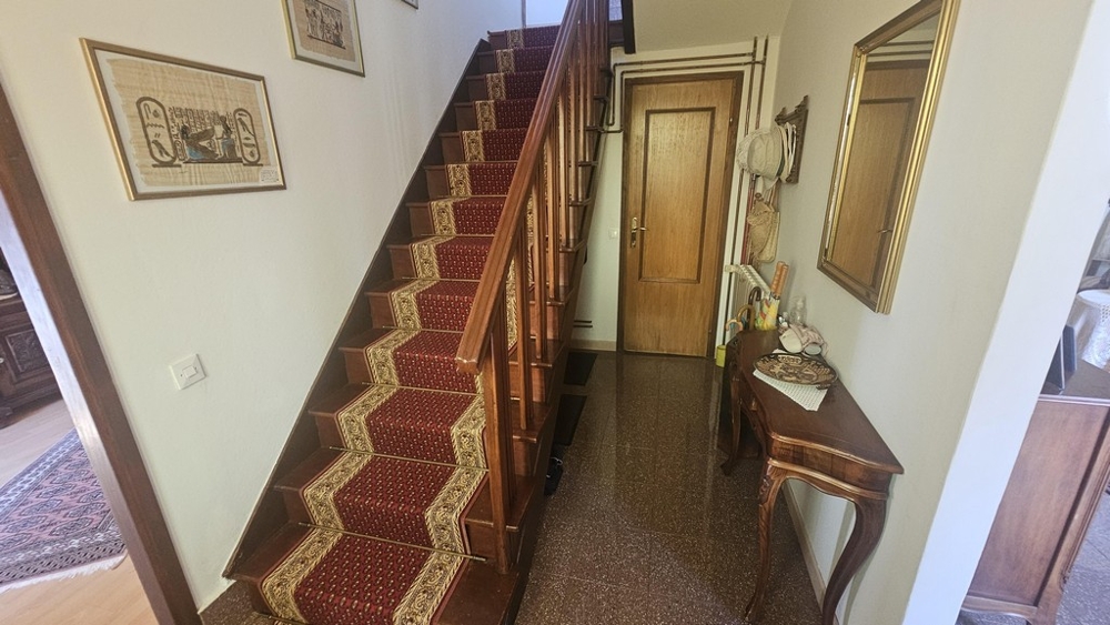 Entrance area with wooden stairs