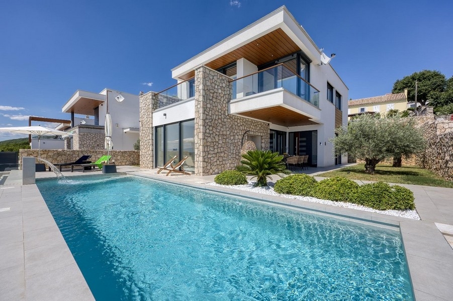 Villa with high-quality natural stone facade and outdoor pool