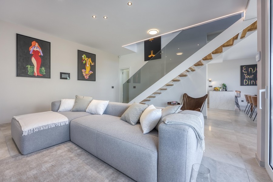 Open living area with modern design and staircase