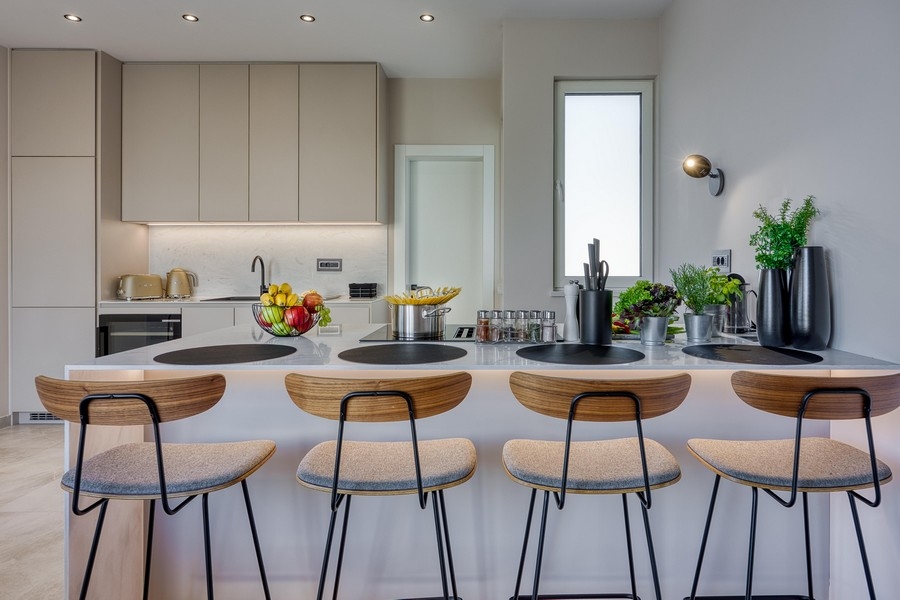 Modern kitchenette with bar stools and elegant interior
