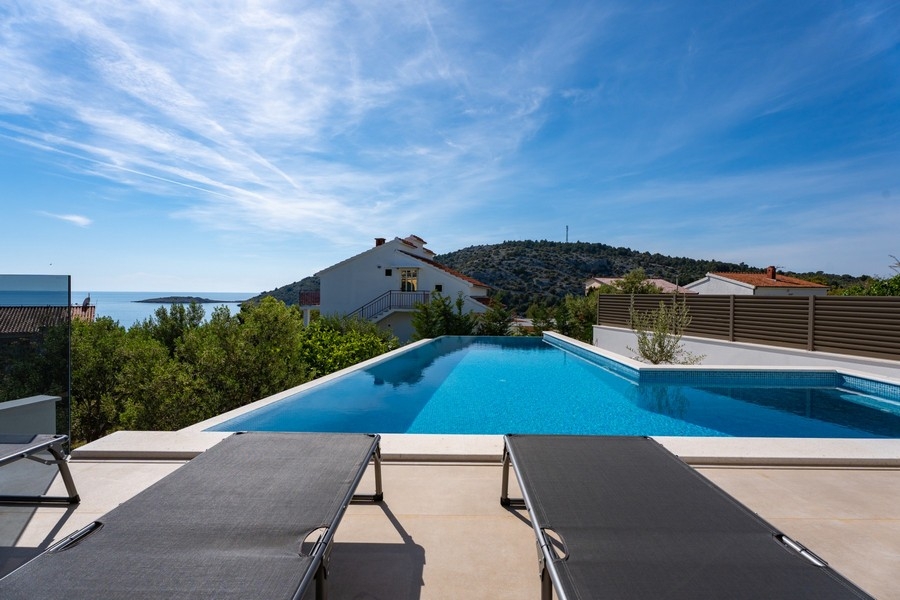 Infinity pool with sea views in front of modern villa in Dalmatia