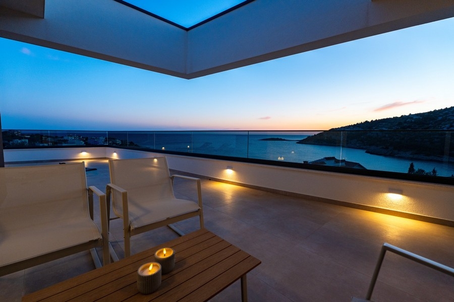 Covered terrace with panoramic sea views in the evening