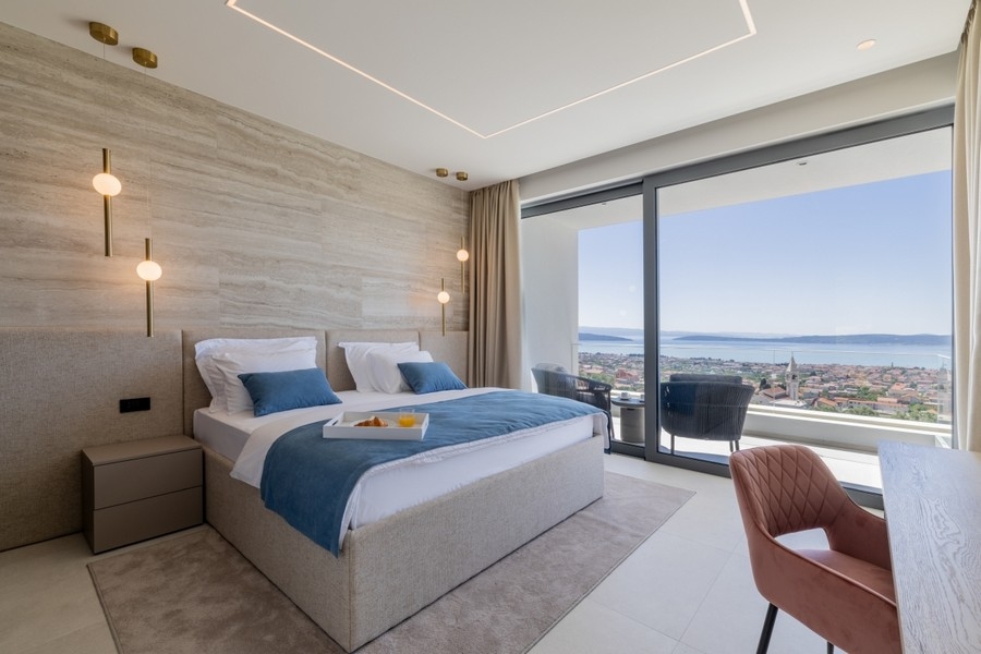 Elegant bedroom with terrace and sea views