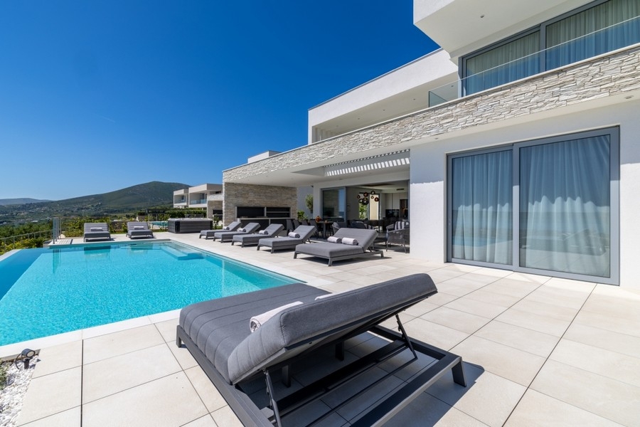 Sun terrace of an exclusive villa with pool and sea views