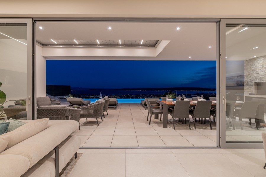 Covered terrace with outdoor kitchen and sea views