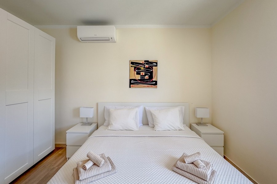 Bright bedroom with double bed