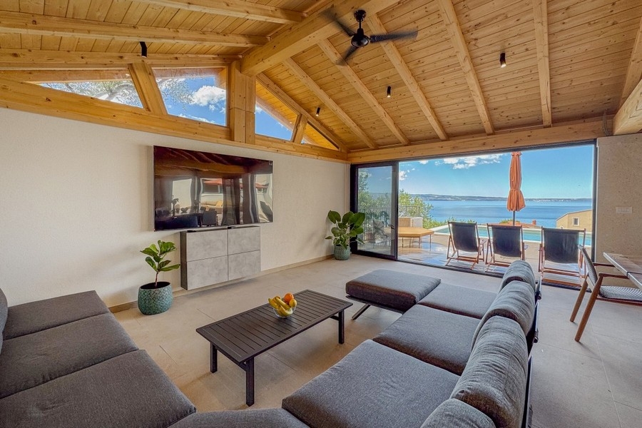 Living room with large glass fronts and sea views