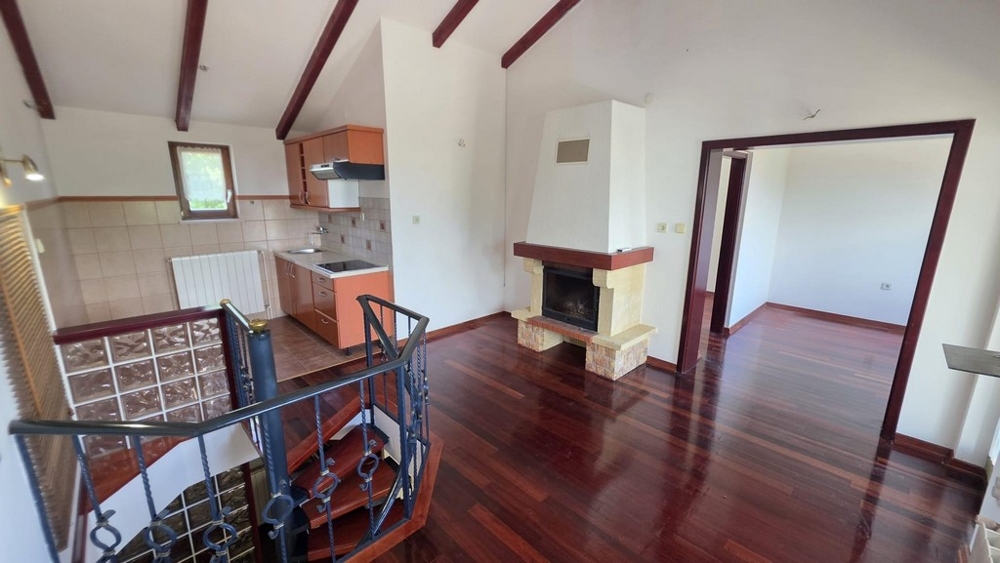 Living room with fireplace and wooden floor
