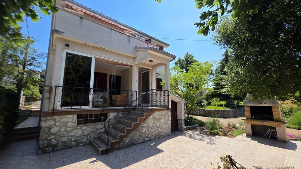 House with barbecue area and terrace