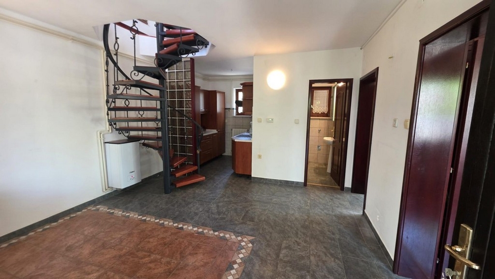 Living area with spiral staircase