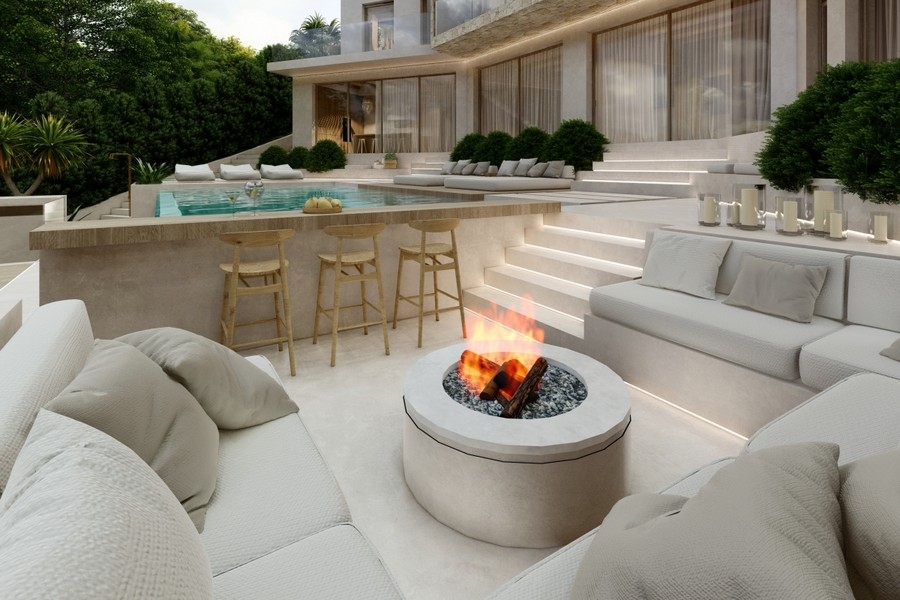 Outdoor lounge with fire pit and pool area of ​​a luxury villa