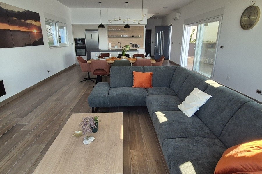 Open living area with kitchen and modern furnishings