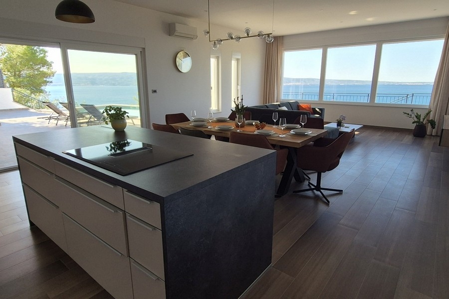 Modern kitchen with cooking island and open living concept