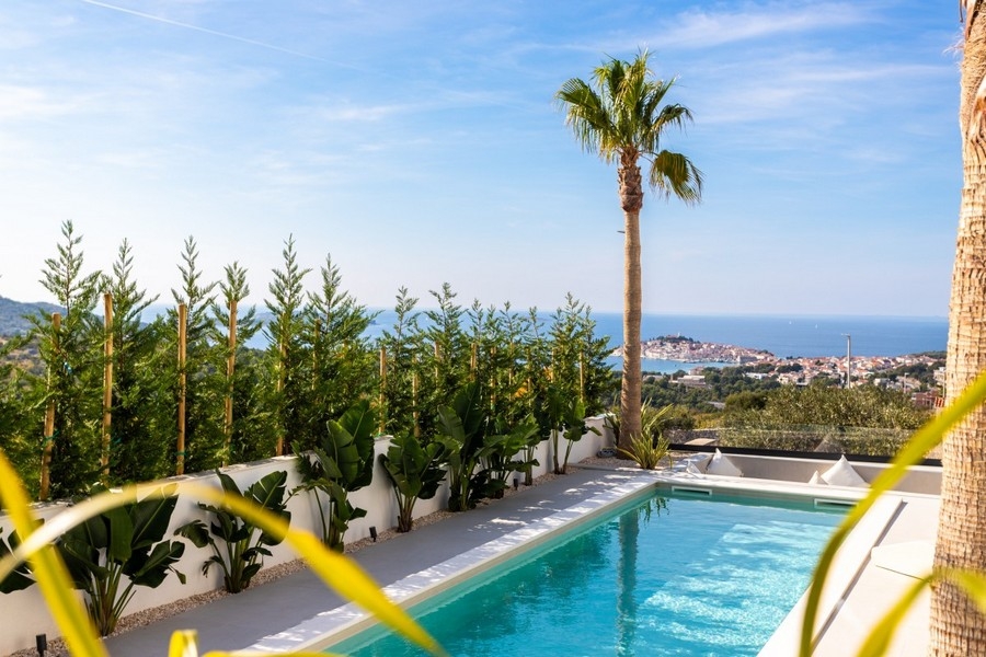 Pool terrace with panoramic coastal views