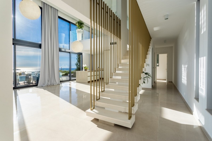 Elegant entrance area with modern stairs