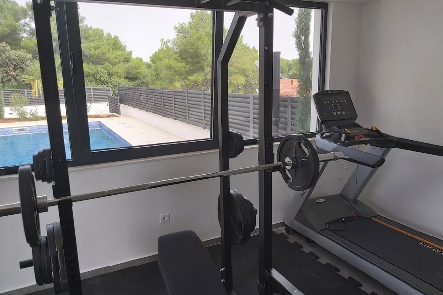 Gym overlooking the pool