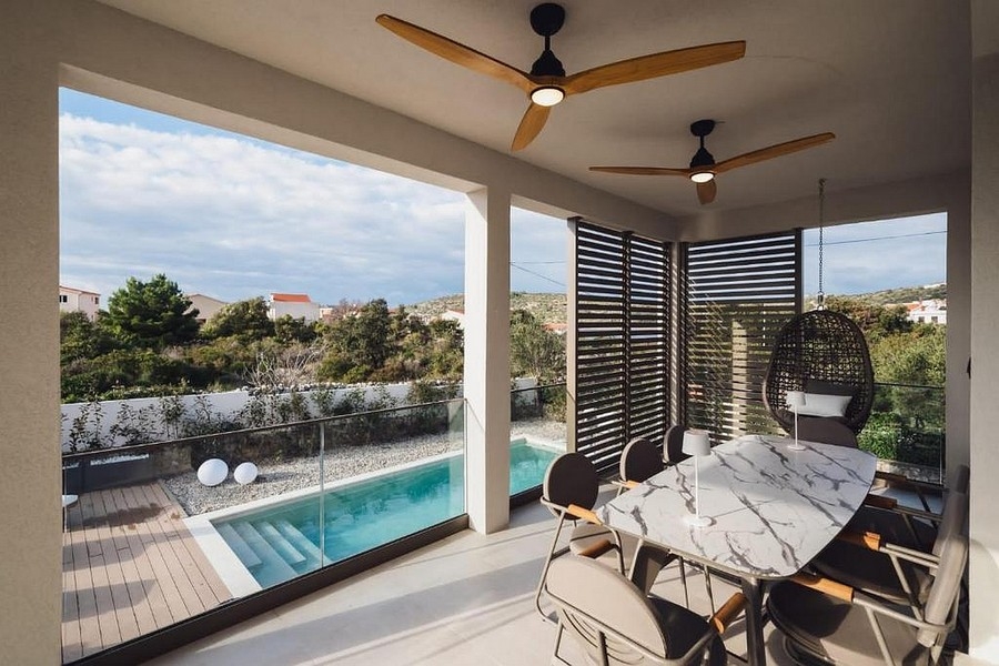 Covered terrace overlooking the pool