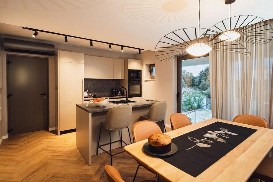 Kitchen with cooking island and dining area