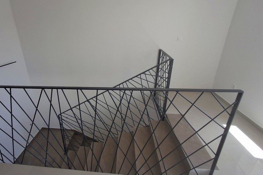 Staircase with metal railings