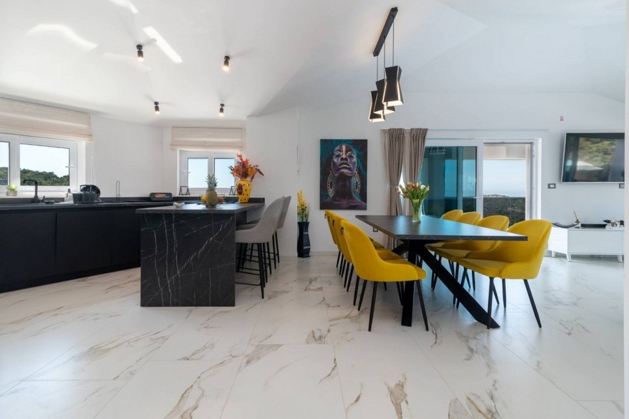 Dining area and kitchen in modern villa