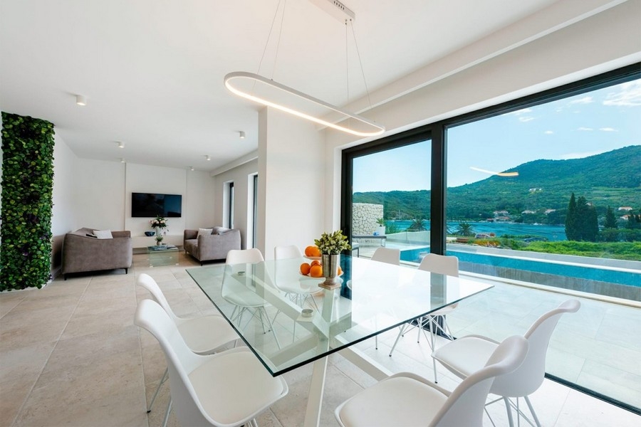 Open plan living and dining area with sea views