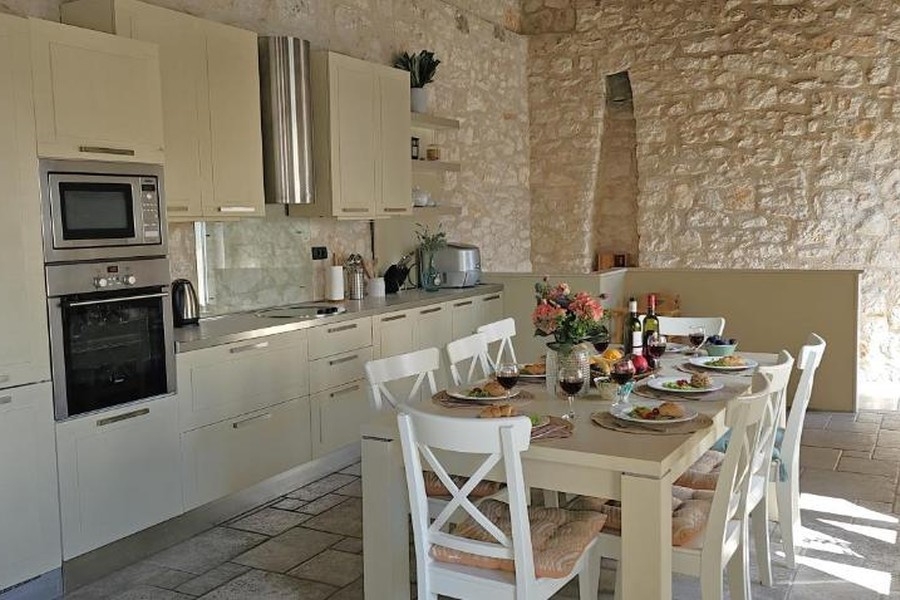 Kitchen with natural stone walls