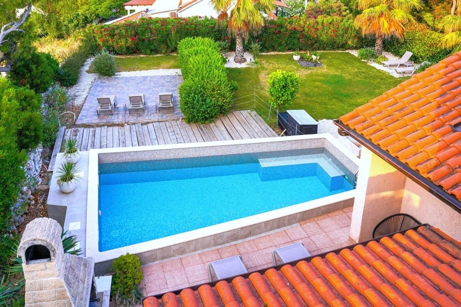 Swimming pool with lounge area and garden