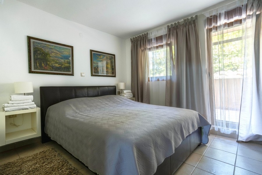 Bedroom with double bed and terrace access