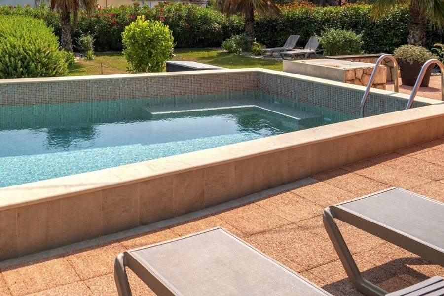 Outdoor fireplace made of natural stone with wood storage
