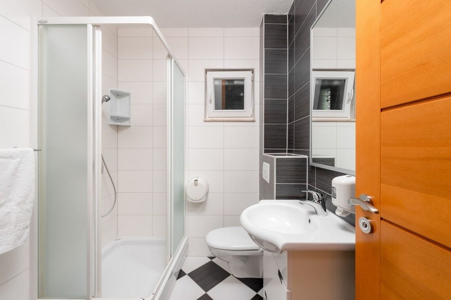 Bathroom with shower and sink