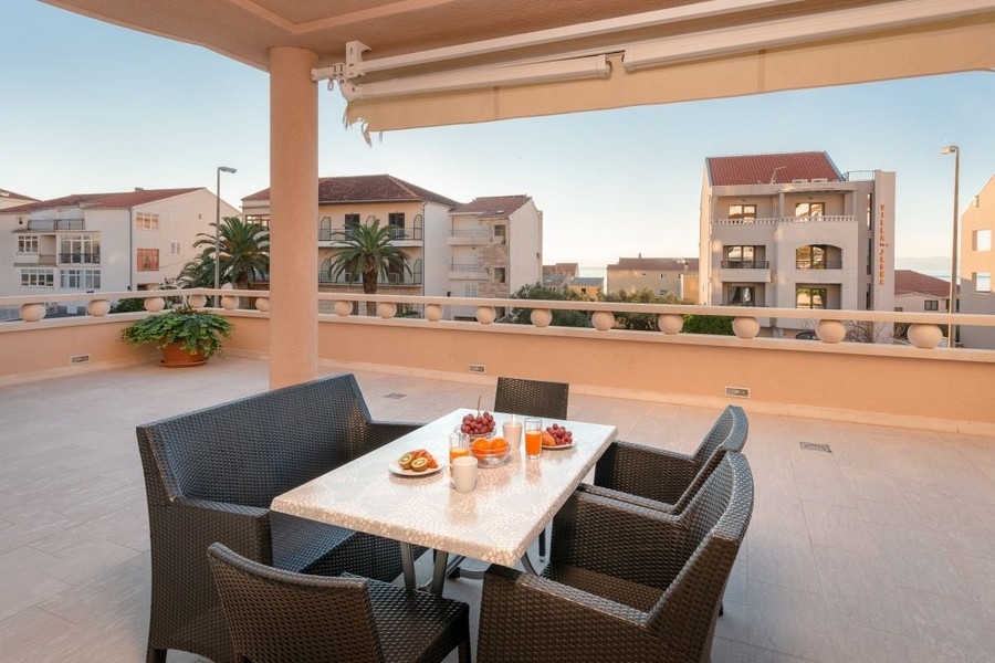 Large sun terrace with seating area