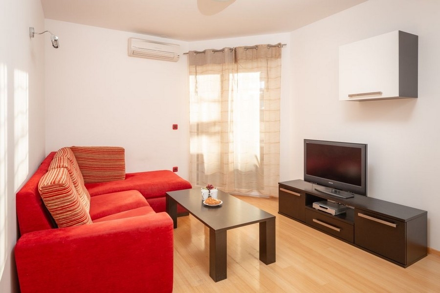 Living room with air conditioning and sofa