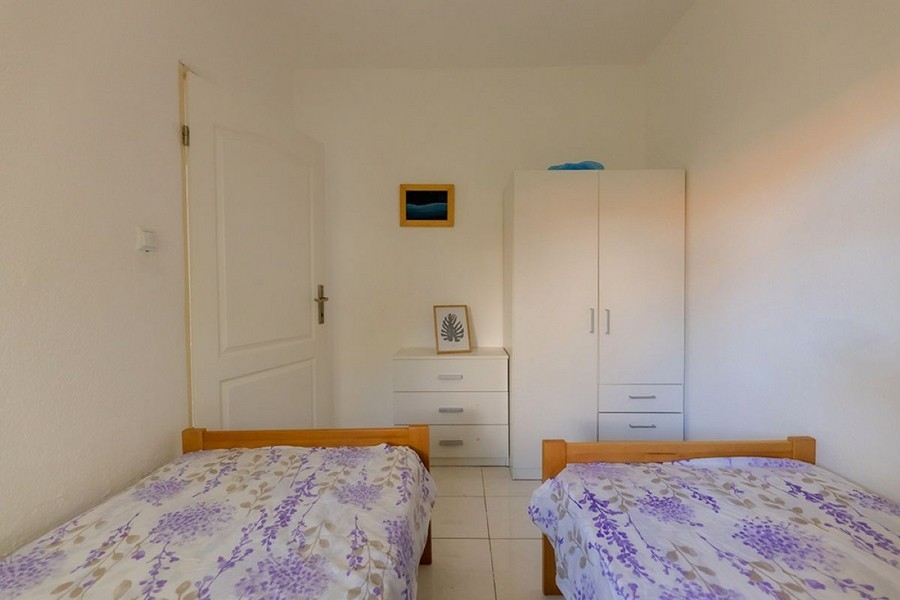 Bright bedroom with single beds