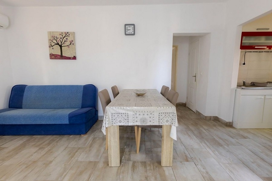 Living area with sofa and kitchenette