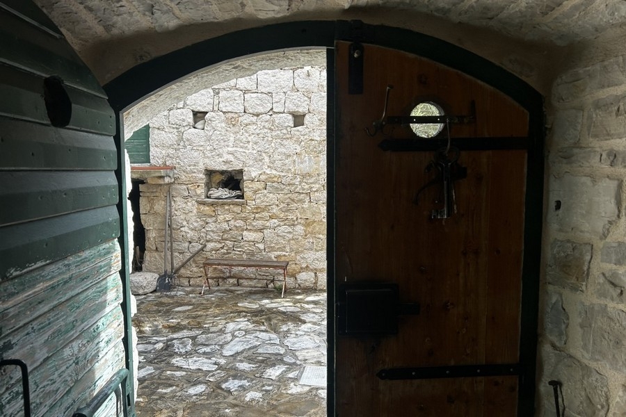 Konoba with wooden door and stone walls