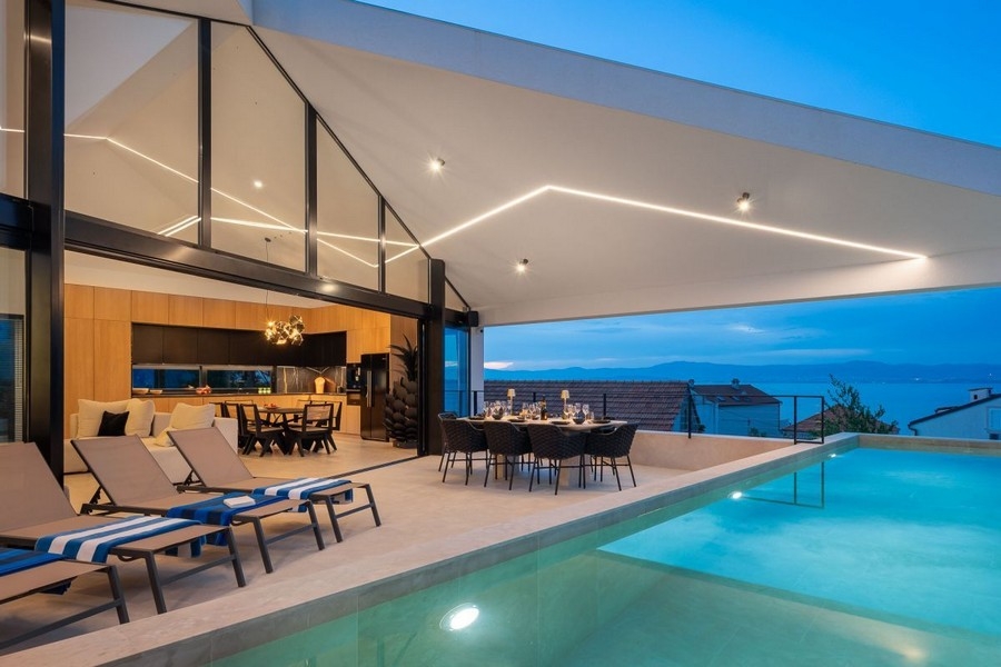 Bright living and dining area with sea views of Brac