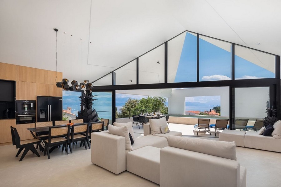 Open living space with panoramic windows and sea views