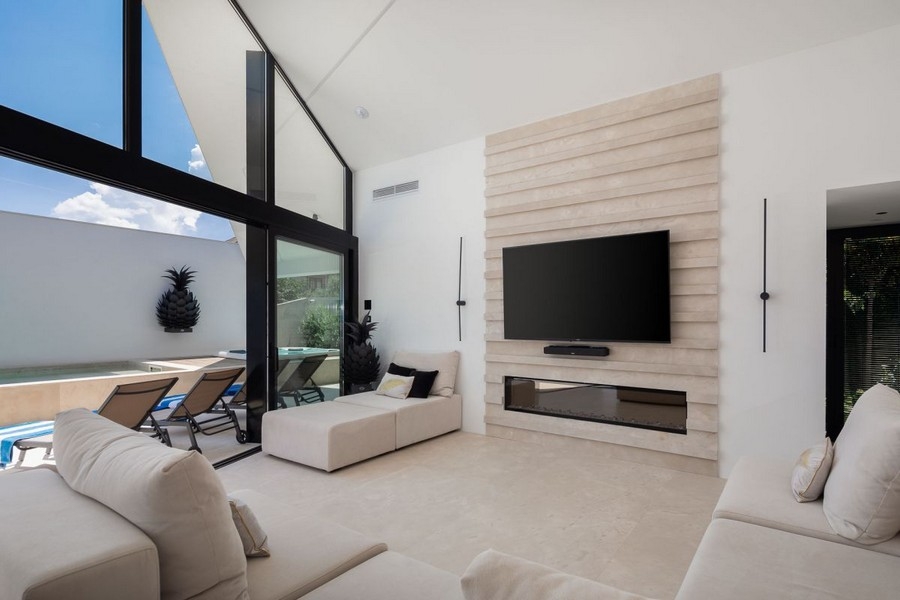 Living room with television and terrace access