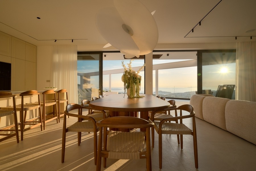 Dining area with panoramic windows and sea views