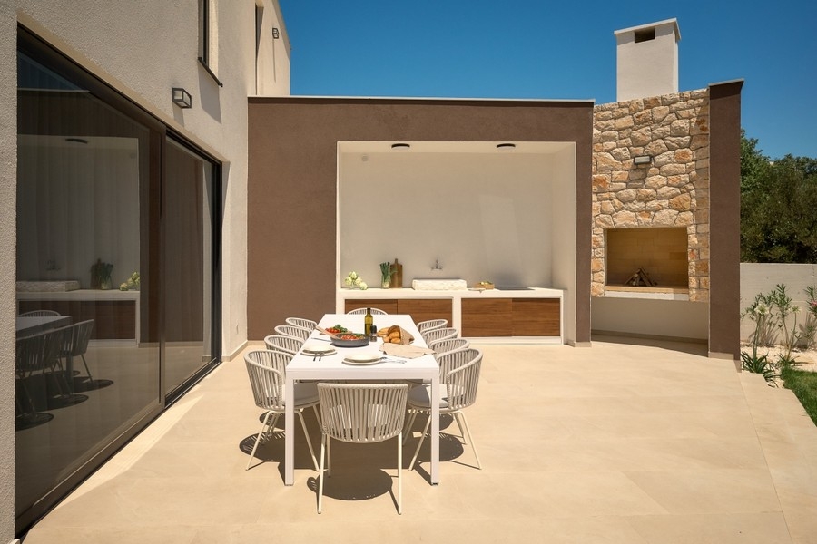 Outdoor patio with outdoor kitchen and fireplace
