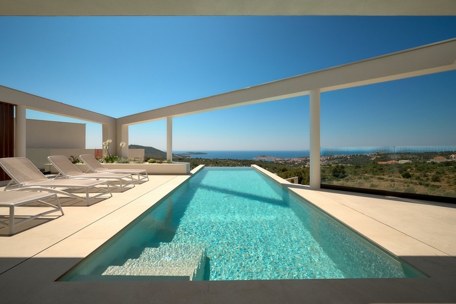 Sun terrace with infinity pool and panoramic sea views