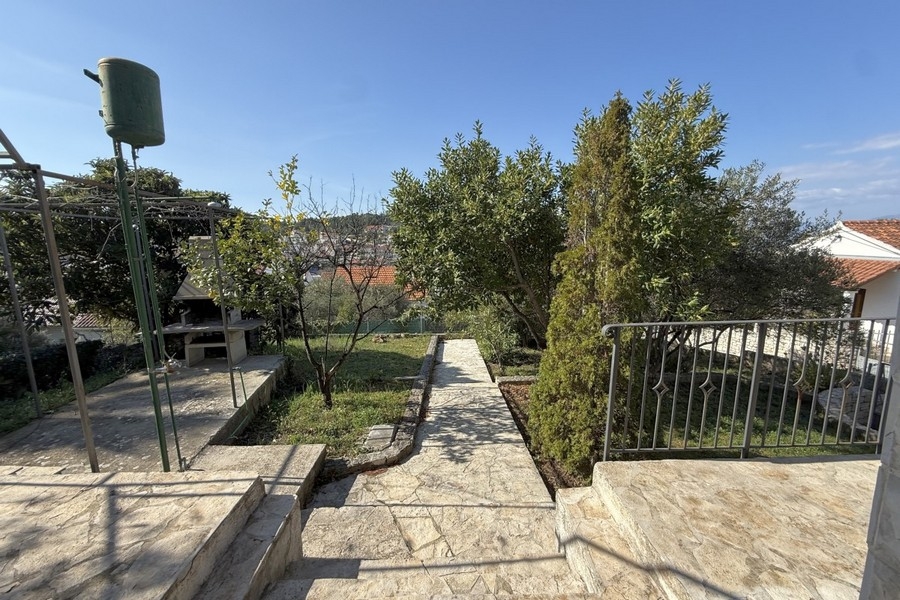 Well-kept garden with paved path