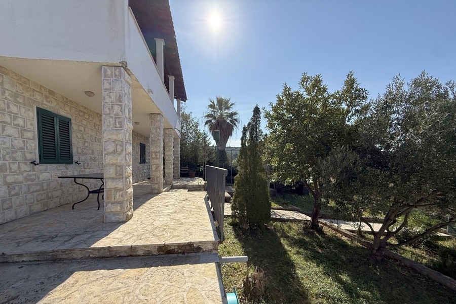 House view with stone facade and garden