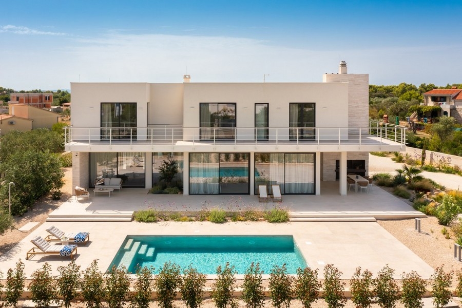 Exterior view of luxury villa with swimming pool