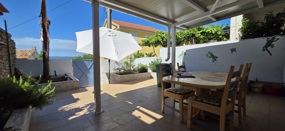 Sun terrace with parasol and sea view