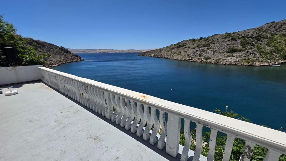 Terrace with balustrade and sea views of the bay