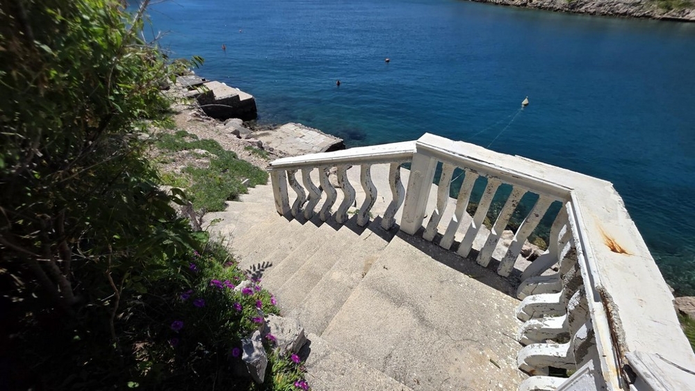 Stone stairs with balustrade to the sea